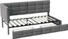 A disassembled grey upholstered bed frame with a slatted base and storage drawers. Produktbild-Vorschau
