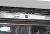 Close-up detail of a dishwasher interior, showing the top rack supports, a light sensor, and the interior light. Produktbild-Vorschau