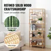 A bamboo bookshelf with various items on display, next to a sofa and a window with blinds. Anteprima dell’immagine prodotto