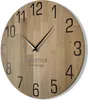 A wooden wall clock with black numbers and hands. Voir les images du produit
