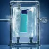 A turquoise bottle is encased in ice, surrounded by pipes and steam, with a pressure gauge visible. Podgląd zdjęcia produktu