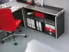 An office desk setup with a red chair. Produktbild-Vorschau