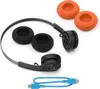 A pair of black headphones with orange and black ear pads and a blue charging cable are laid out on a white background. Voir les images du produit