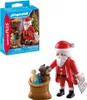 A Playmobil Santa Claus set with a gift bag and a wish list, shown with its packaging. Náhľad obrázku produktu