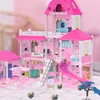 A detailed, multi-story pink dollhouse with furniture, accessories, and small figures. Voir les images du produit
