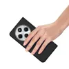 A hand holding a black phone case with a phone inside. Produktbild-Vorschau