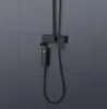 A black shower filter attached to a black shower head and hose, mounted on a gray tiled wall. Anteprima dell’immagine prodotto