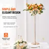 A wedding table setting with floral arrangements and crystal decor. Podgląd zdjęcia produktu