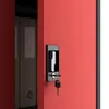 Close-up of a red metal cabinet door with a black lock and key. Anteprima dell’immagine prodotto