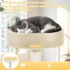 A cat sleeping on a cat tree near a window. Náhľad obrázku produktu