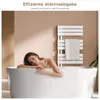 A woman relaxing in a bathtub with a white towel rack in the background. Podgląd zdjęcia produktu