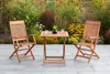 A wooden garden furniture set with two chairs and a table on a patio, surrounded by plants and flowers. Produktbild-Vorschau