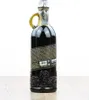 A dark glass bottle of rum with a label and a handle, placed on a wooden surface. Produktbild-Vorschau
