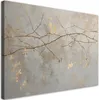 A close-up of a canvas print featuring branches against a textured gray and gold background. Produktbild-Vorschau