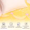 A close-up view of a bedding set with a pillow and a patterned sheet, featuring icons and text describing product features. Podgląd zdjęcia produktu