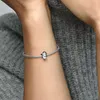 A close-up shot of a person's arm wearing a silver bracelet with a penguin charm. Produktbild-Vorschau