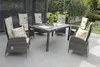 An outdoor patio set with a table and chairs, featuring cushions with an olive pattern. Produktbild-Vorschau