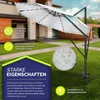 A white cantilever umbrella is shown in a garden setting, with a house in the background. The image includes text overlays highlighting product features. Voir les images du produit
