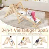 A child playing on a wooden climbing structure with a slide, set indoors on a carpeted floor. The image is overlaid with promotional text and smaller inset images showcasing different configurations of the product. Produktbild-Vorschau