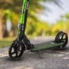 A close-up shot of a green and black Xride scooter on a paved surface with blurred trees in the background. Náhľad obrázku produktu
