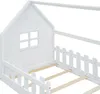 A close-up view of a white wooden children's bed frame with a house-like structure and a picket fence detail. Produktbild-Vorschau