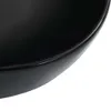 A close-up view of the edge of a black ceramic sink. Náhľad obrázku produktu