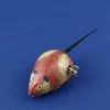 A wind-up tin toy mouse on a blue background. Produktbild-Vorschau