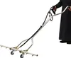 A person in a black robe is holding a pressure washer attachment with wheels. Produktbild-Vorschau