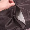 A hand is shown unzipping a brown dog bed cover, revealing a light gray interior. Produktbild-Vorschau