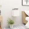 A white cube-shaped nightstand is mounted on a white wall, with a stack of books on top. A potted fern sits on the floor below. Voir les images du produit