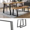 A dining table and bench with black metal legs and wooden tops, set on a rug in a dining room. Náhľad obrázku produktu