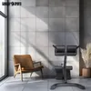 A gym equipment setup in a modern room with a large window and a chair. Produktbild-Vorschau