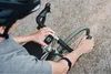 A person is shown adjusting a bike computer while on a bicycle. Náhled obrázku produktu