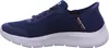 A side view of a blue Skechers sneaker with a white sole. Voir les images du produit