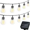 A string of solar-powered LED lights with a solar panel. Náhľad obrázku produktu