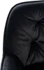 Close-up view of the tufted seat of a black velvet bar stool. Podgląd zdjęcia produktu