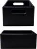 Two black wooden storage boxes are shown against a white background. The top box has cut-out handles on the front and top, while the bottom box is a simple rectangular shape. Produktbild-Vorschau