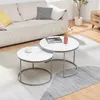A living room scene with a couch, coffee tables, and a rug. Voir les images du produit