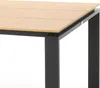 A close-up view of a table corner, showing the wooden tabletop and black metal legs. Náhled obrázku produktu