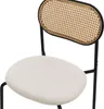 A close-up view of a chair with a rattan back and a beige upholstered seat. Náhled obrázku produktu