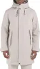 A man wearing a beige parka jacket.