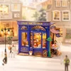 A miniature model of a tea room with detailed interior and exterior. Produktbild-Vorschau