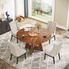 A round dining table with four chairs set in a dining room with a large window overlooking a garden. Podgląd zdjęcia produktu