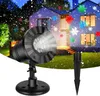 A snowflake projector light is shown in use, projecting snowflakes onto a house and lawn during nighttime. Produktbild-Vorschau