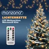 A Christmas tree decorated with warm white LED lights, with a remote control and product text overlay. Náhled obrázku produktu