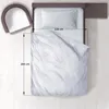 A top-down view of a bed with a duvet and pillow, next to a chair. Dimensions are indicated. Anteprima dell’immagine prodotto