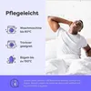 A man stretching in bed next to a panel with care instructions. Produktbild-Vorschau