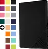 A black fitted sheet is shown on a white background, with a grid of color swatches to the left. Produktbild-Vorschau