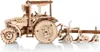 A wooden model tractor with a plow attached, shown from the side against a white background. Náhľad obrázku produktu