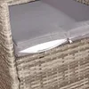 A close-up of a gray cushion on a rattan chair. Produktbild-Vorschau
